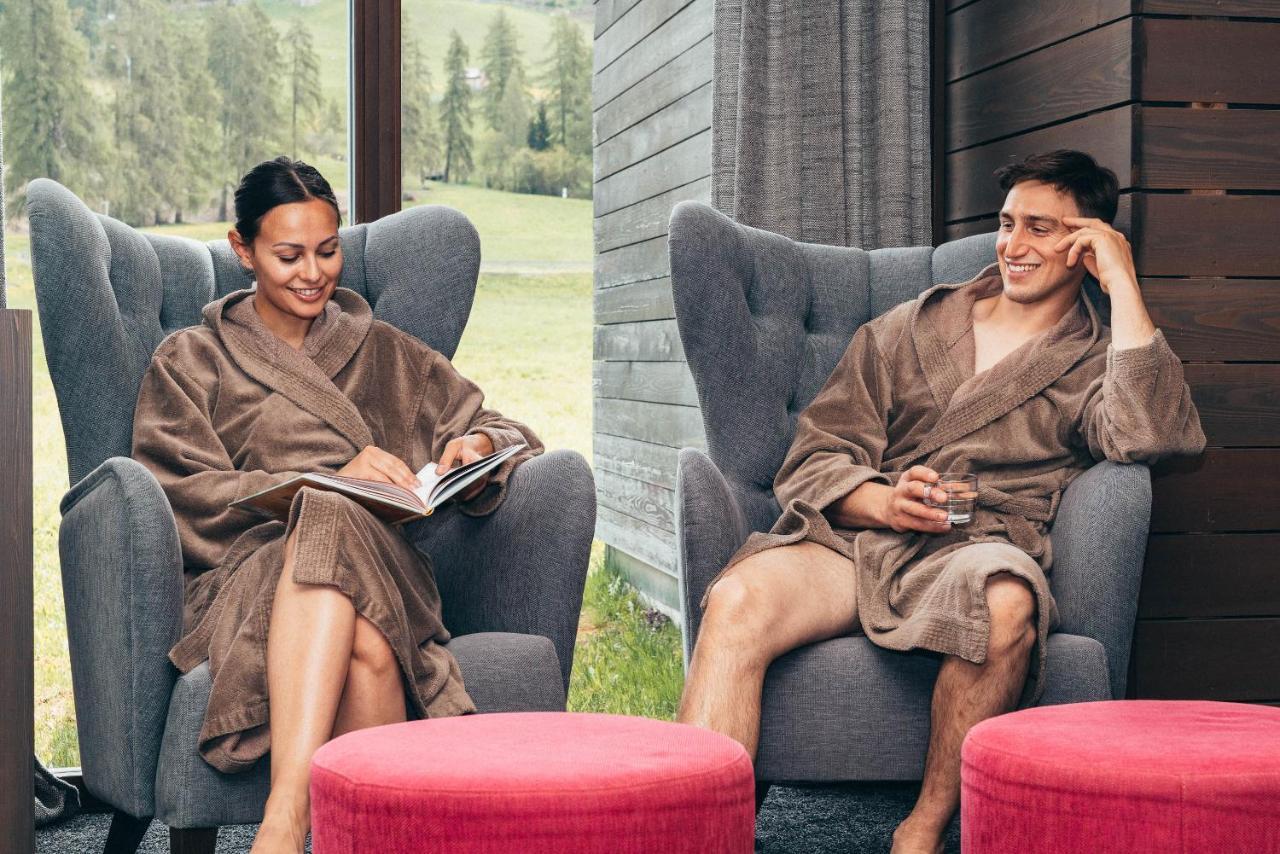 Hotel Monika Sexten Exteriör bild A couple wearing bathrobes