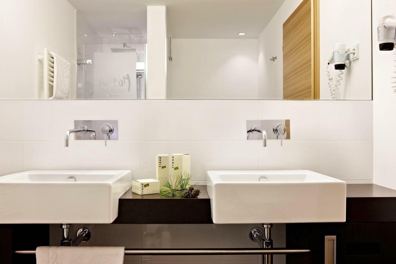 Hotel Monika Sexten Exteriör bild Bathroom with wall mounted taps